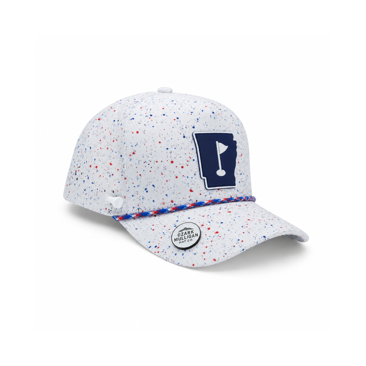 A white baseball cap with red and blue speckles, featuring a navy blue patch with a golf flag design on the front and a braided red, white, and blue band across the visor.