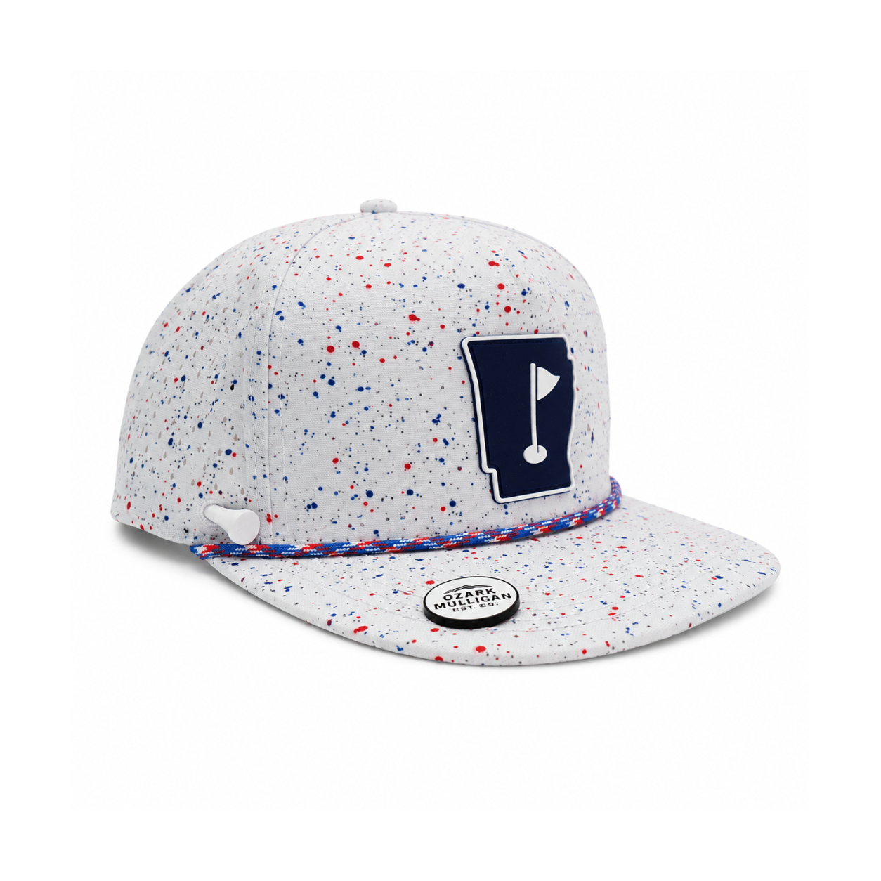 A white snapback cap with red and blue paint splatters, featuring a navy blue patch shaped like the state of Vermont with a golf flag on the front, and a red, white, and blue braided trim along the brim's edge.